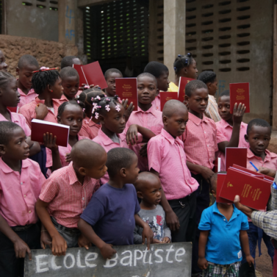 Handing out bibles in Haiti